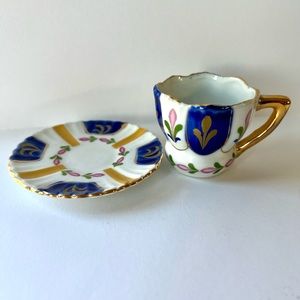 Vintage miniature tea cup and saucer, blue and gold, perfect for decoration
